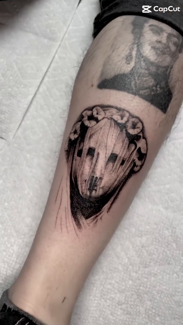 Creepy face with flowers dark realism tattoo by Bryan