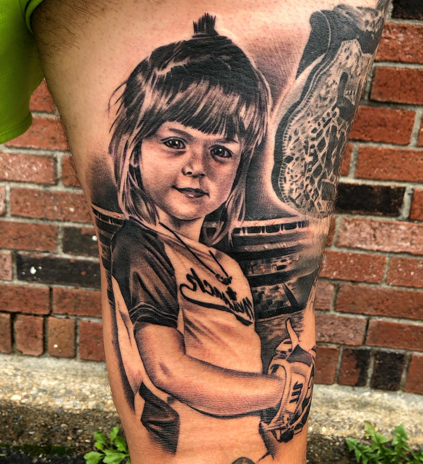 Child portrait realism tattoo on the thigh by Mike Doherty, Abington, Massachusetts