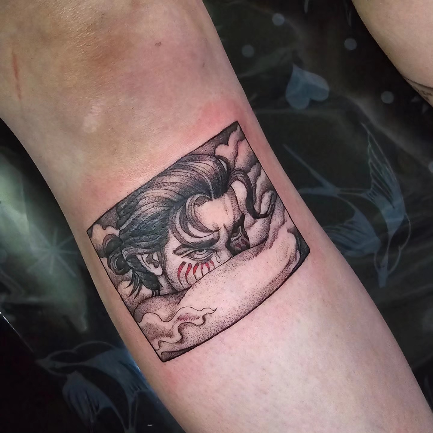 Clown black and grey tattoo on the forearm by Utah Tattoo Artist
