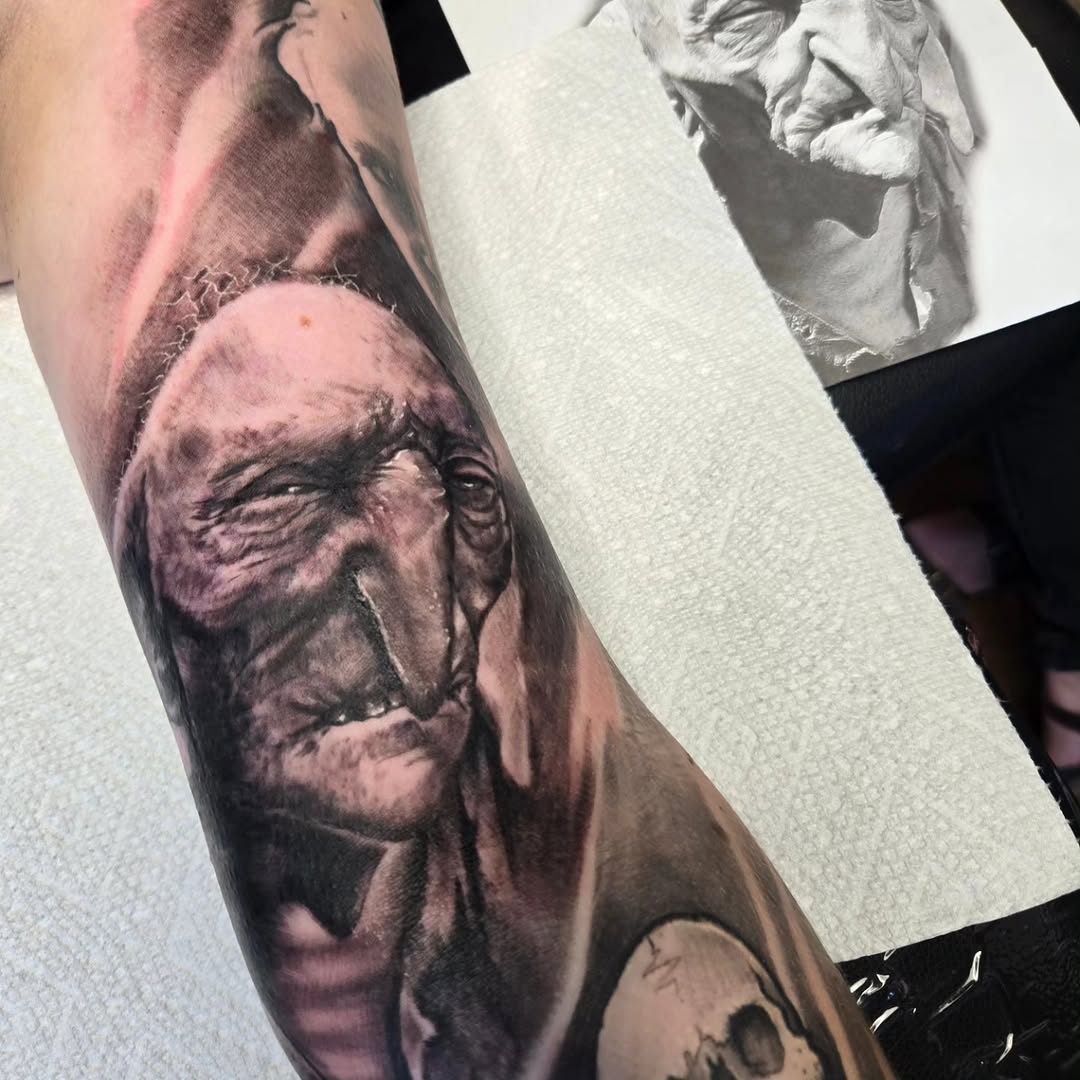 Surrealism tattoo on the forearm by David Johnson