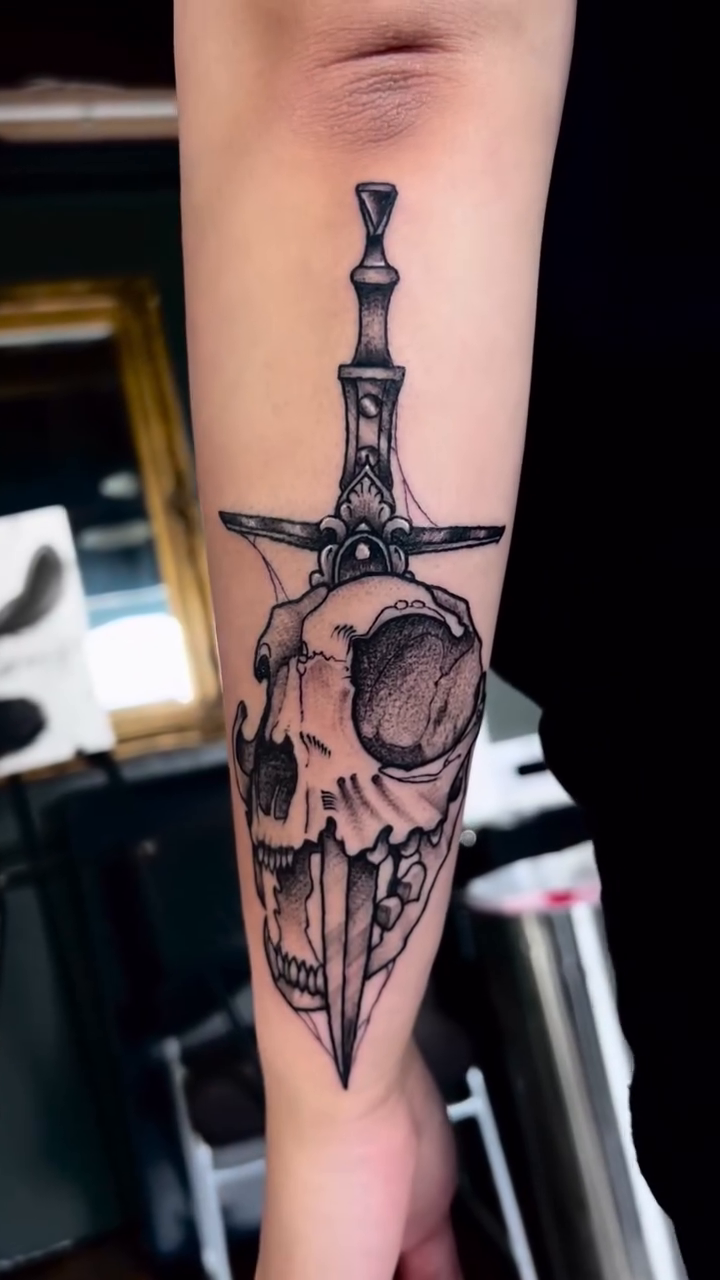 Skull with sword realism tattoo by Ashley Fino, Las Vegas, Nevada