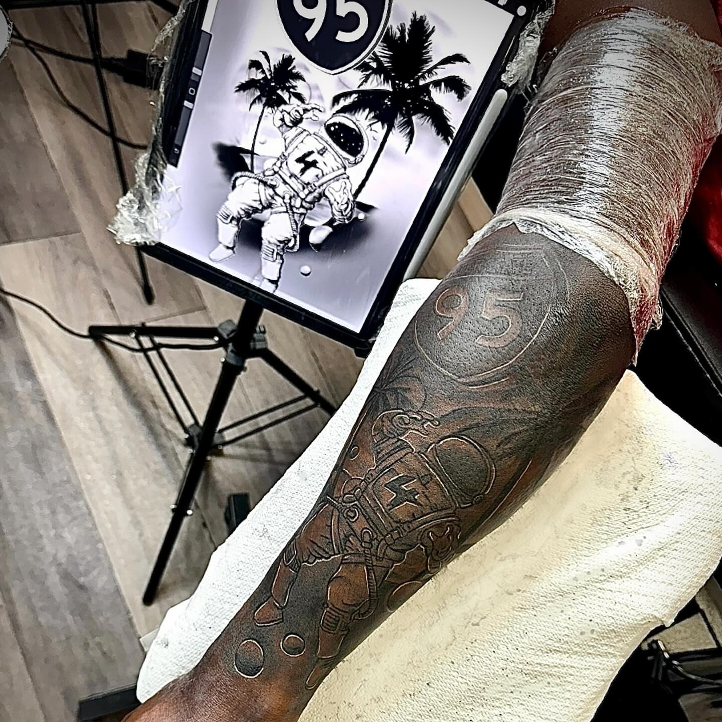 Astronaut black and grey tattoo on the forearm by Tatt2T (T King)