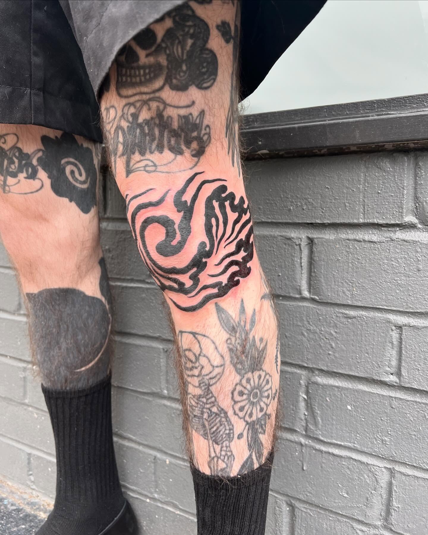 Flame tribal tattoo on the calf by Matt E.
