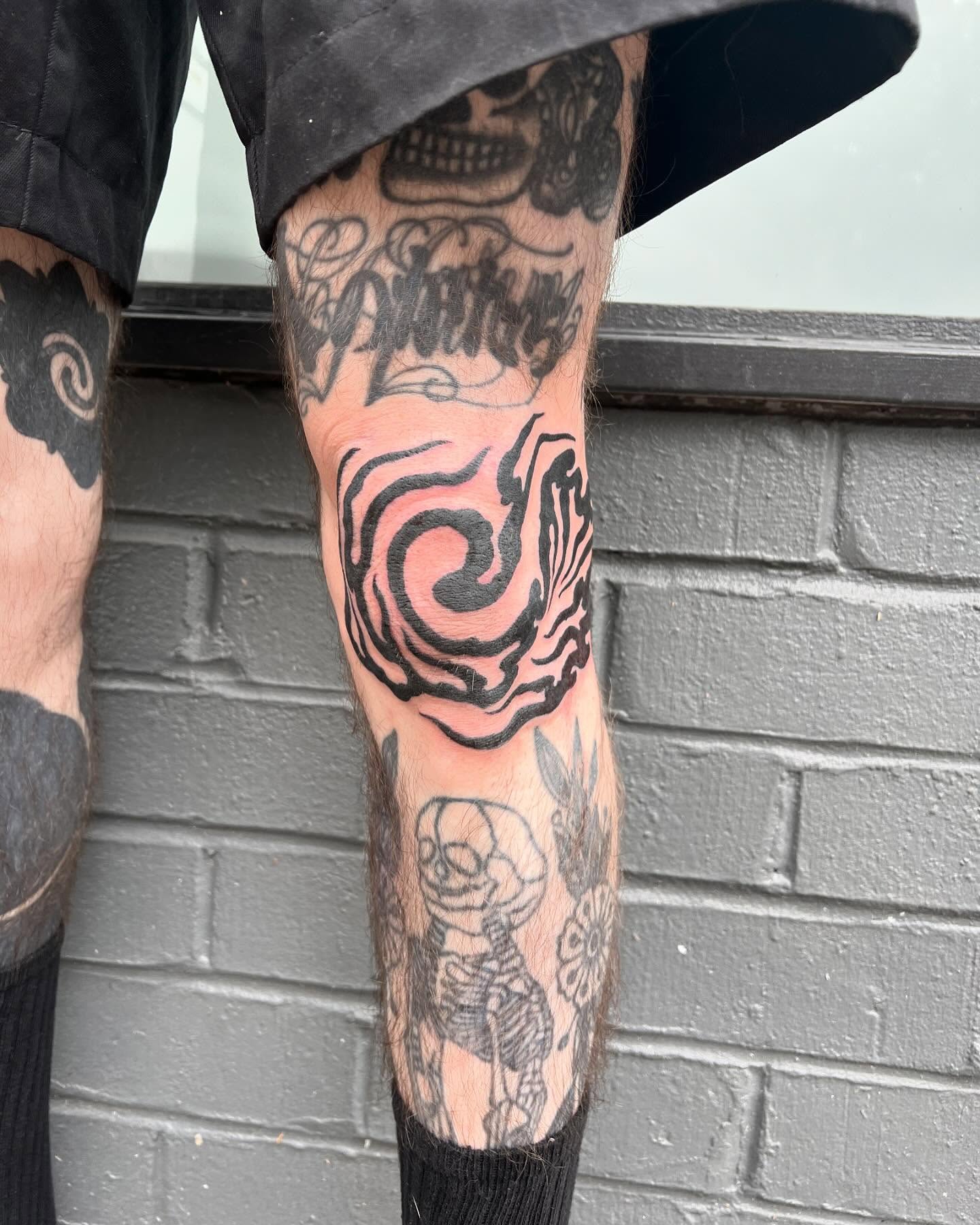 Swirl black and grey tattoo on the calf by Matt E.