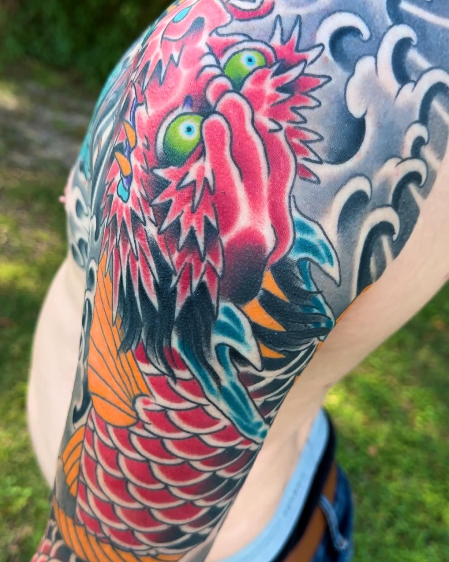 Koi fish japanese irezumi tattoo on the upper arm by Scott Allen Cooksey, Plano, Texas