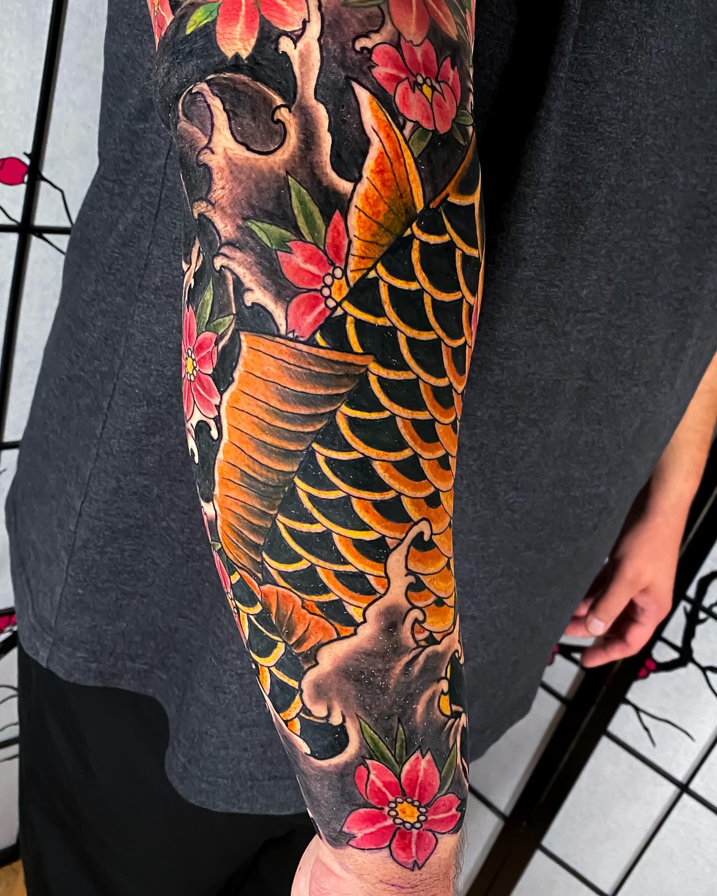 Koi fish and flowers japanese irezumi tattoo on the forearm by Eric James, Phoenix, Arizona