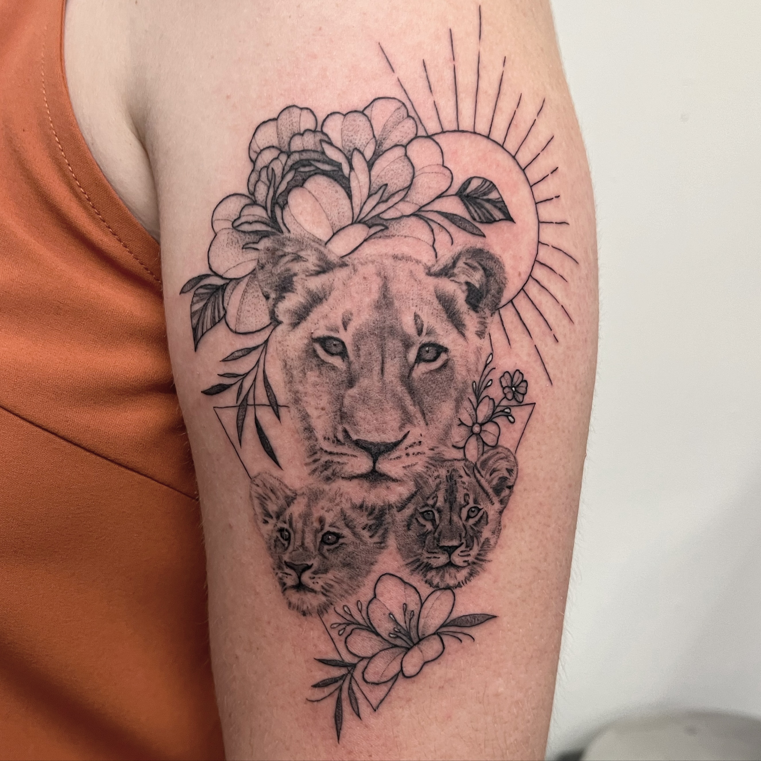 Lion family realism tattoo on the forearm by liliana lopez
