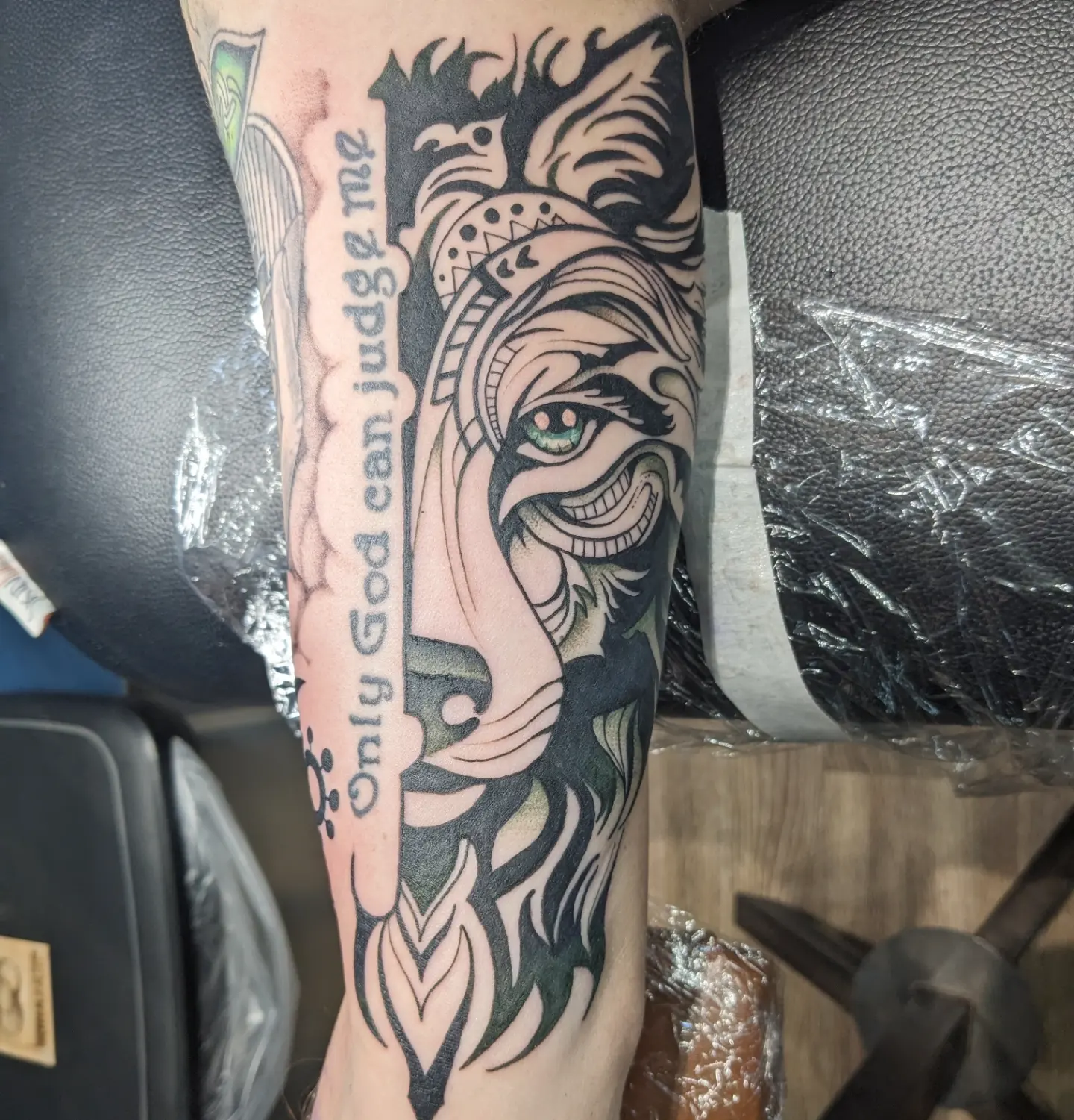 Lion head black and grey tattoo on the forearm by Lizzy Smith, Leander, Texas