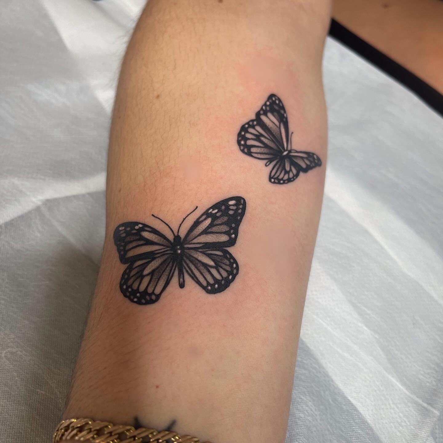 Butterfly black and grey tattoo on the forearm by Carla V