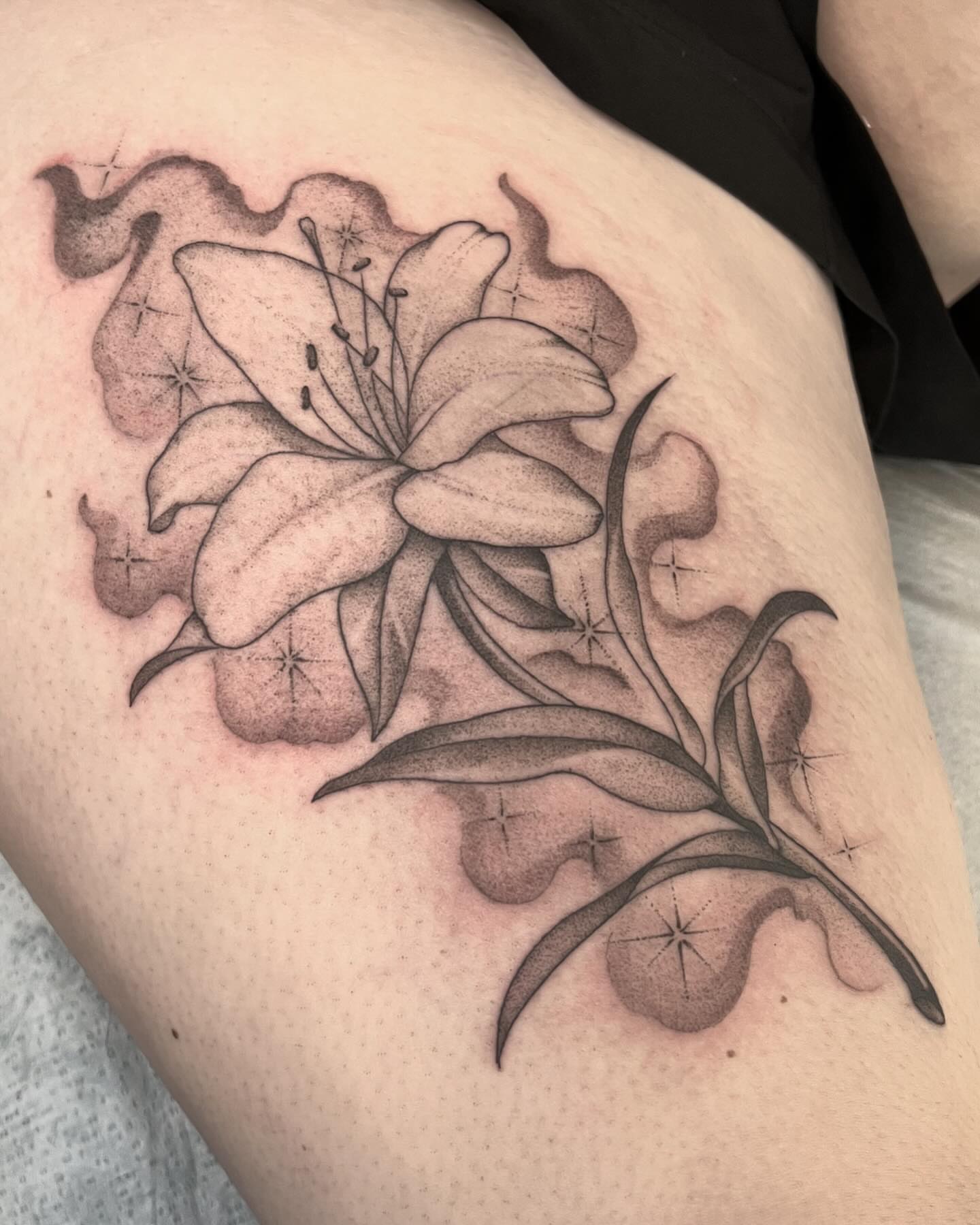 Lily black and grey tattoo on the thigh by Will Campbell