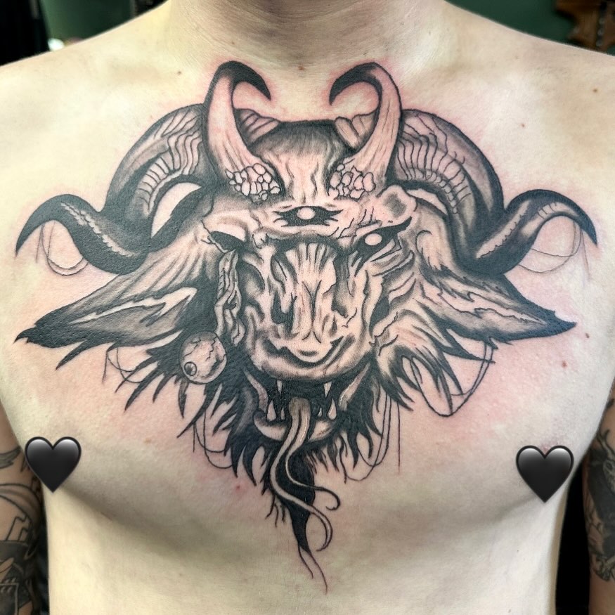 Demonic goat head dark art tattoo on the chest by Mika'la Berry