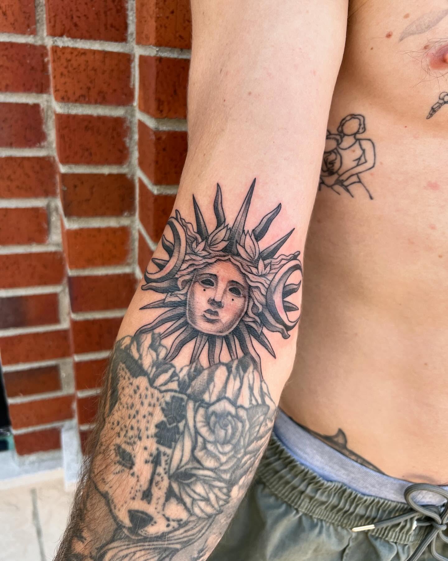 Sun and roses realism tattoo on the forearm by Tasha Venola, Bellingham, Washington