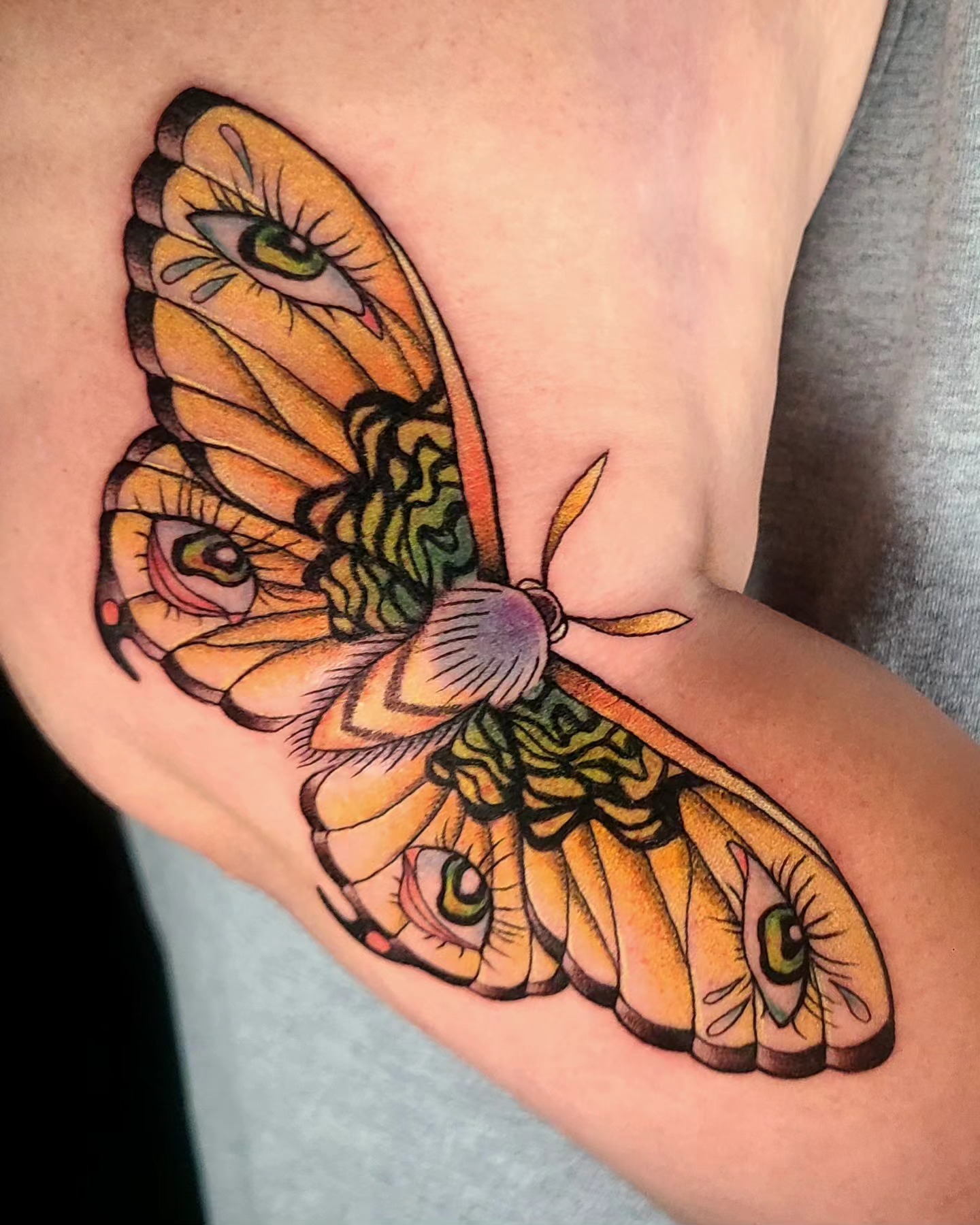 Eye moth American traditional tattoo on the forearm by Chloe🌿Tattoos