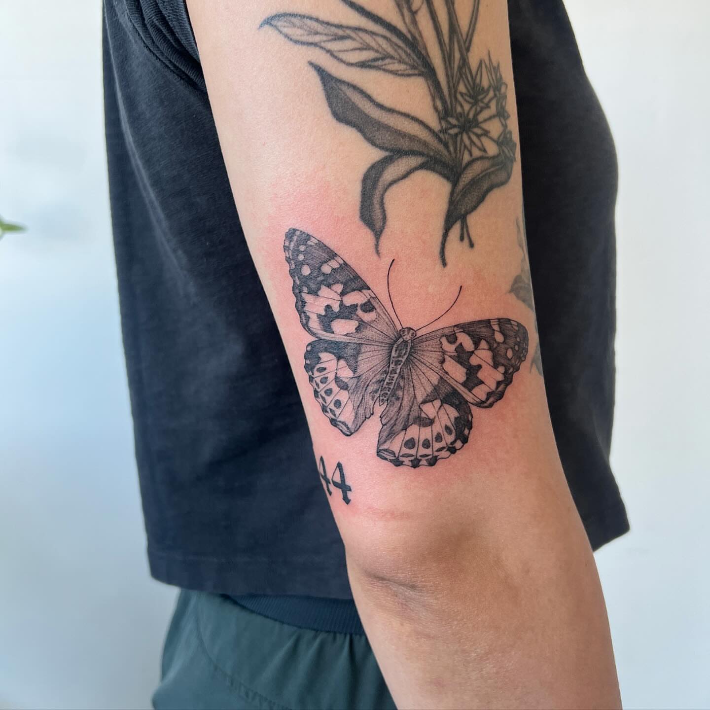 Butterfly black and grey tattoo on the forearm by See See : botanical tattoo artist :
