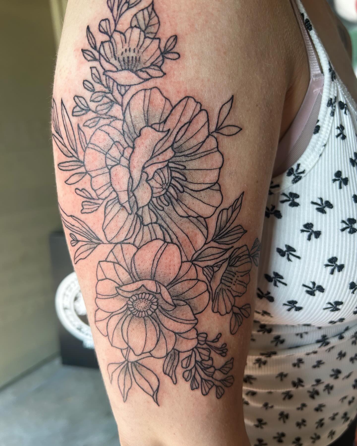 Floral bouquet black and grey tattoo on the forearm by goose 🪿