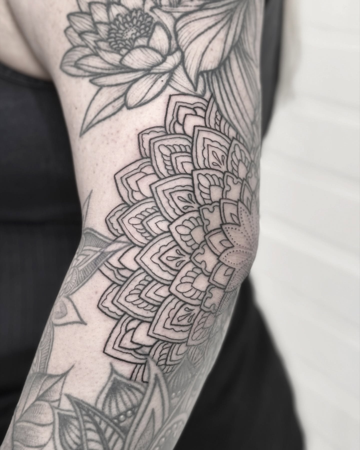 Mandala geometric tattoo on the forearm by Alex Shakuto Tattoo