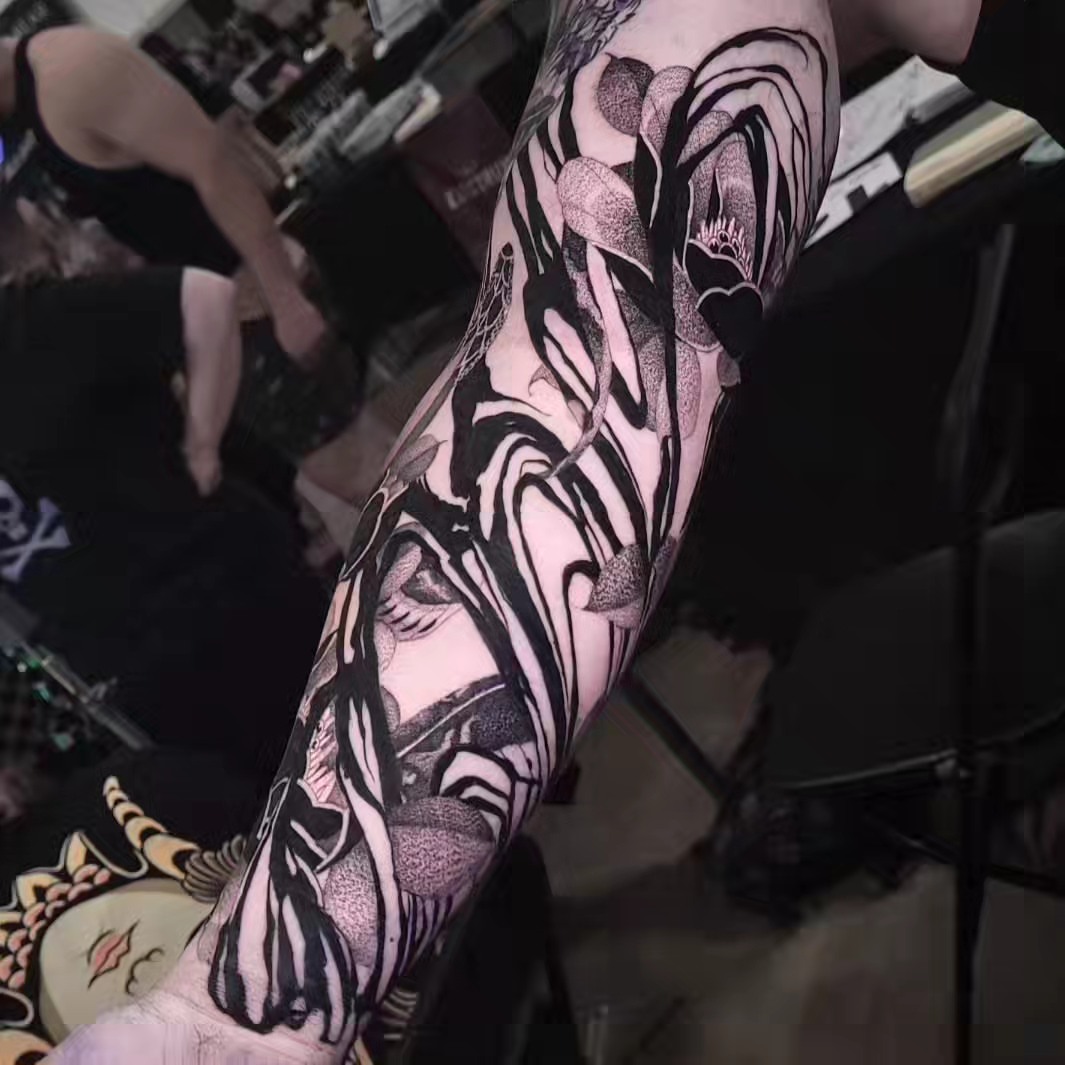 Abstract floral dotwork tattoo on the forearm by miami tattoo artist