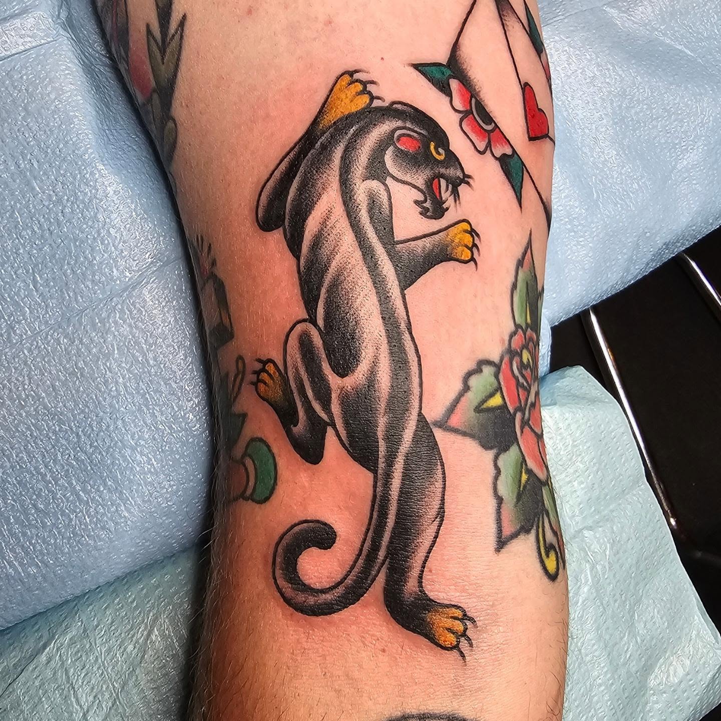 Panther American traditional tattoo on the forearm by Jared Green