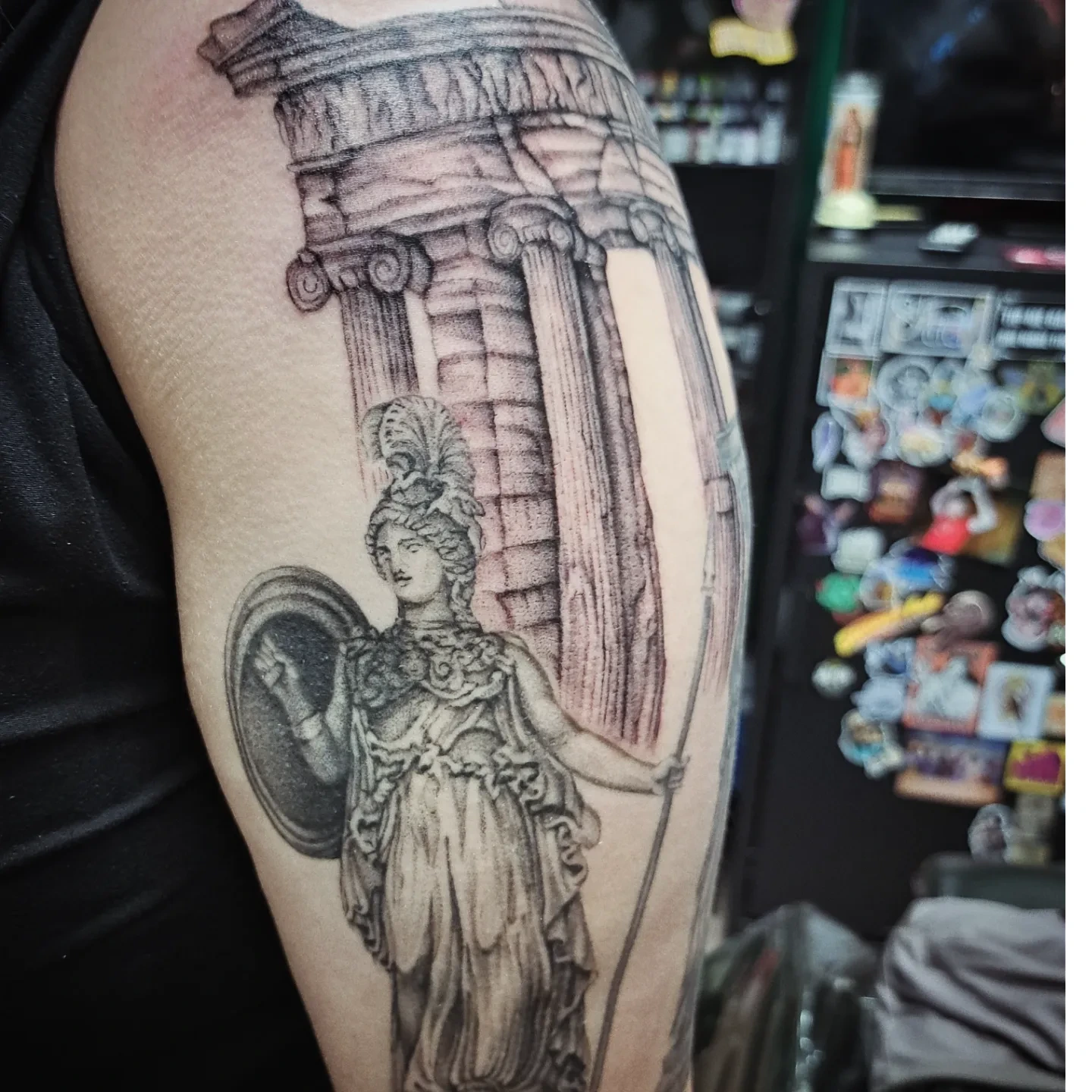 Statue of Athena realism tattoo on the forearm by Kenzie Shepherd