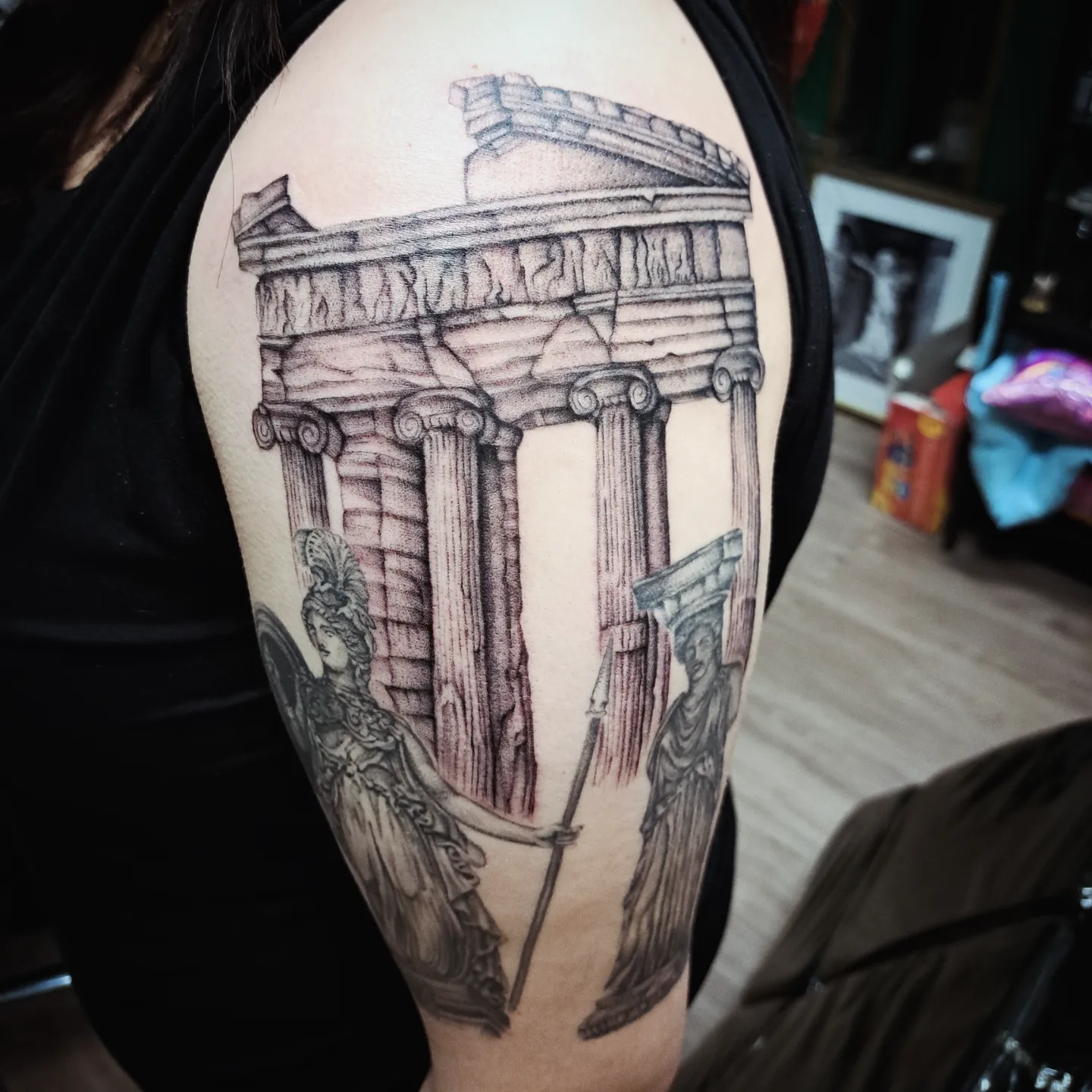 Ancient temple and goddess realism tattoo on the upper arm by Kenzie Shepherd