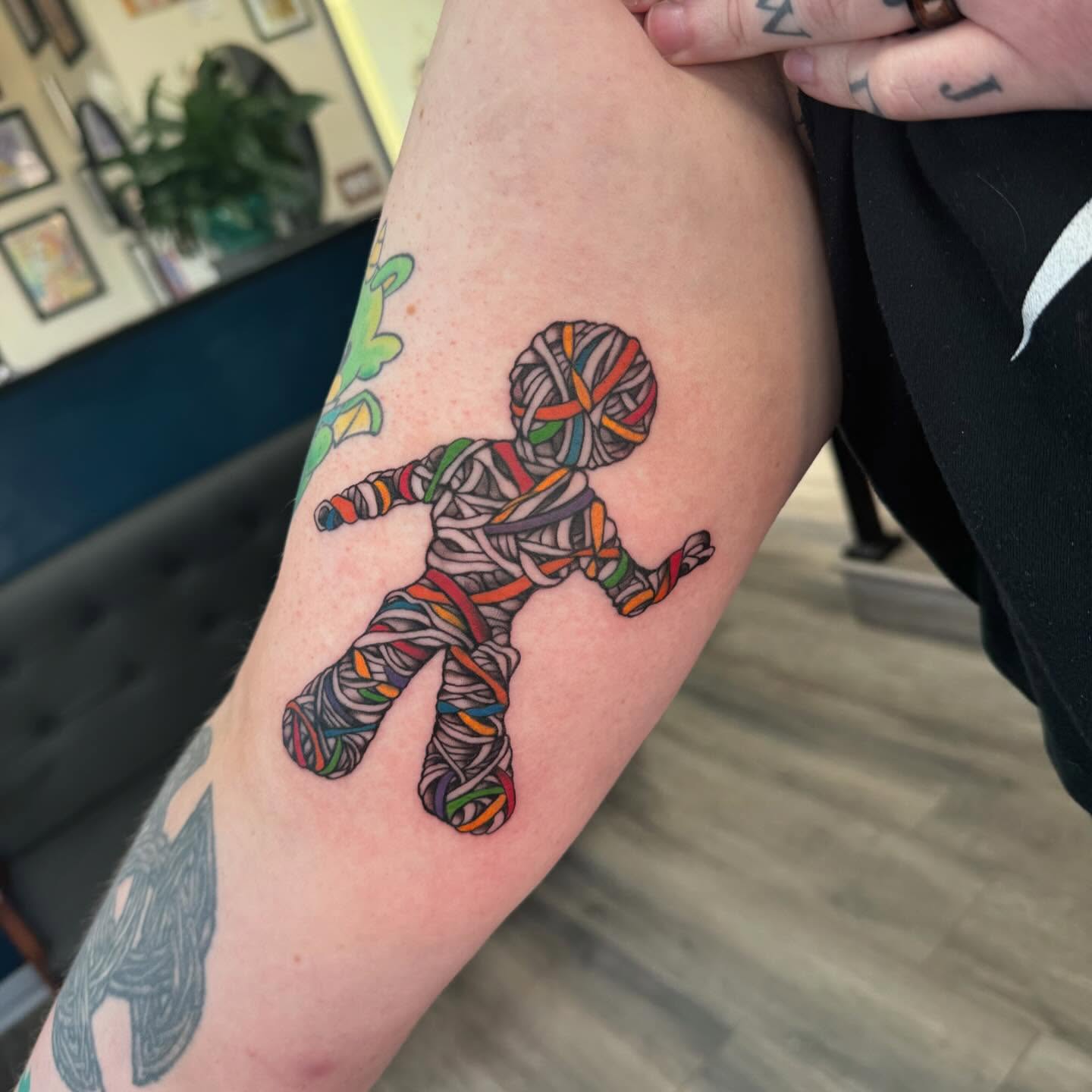 String mummy dotwork tattoo on the forearm by Robyn Mahon