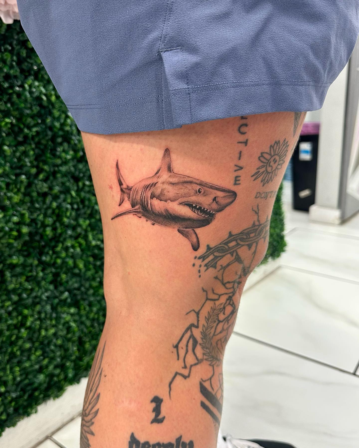 Shark realism tattoo on the thigh by Erika Nambo