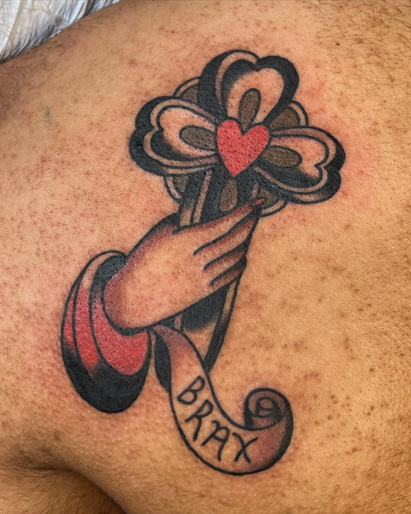 Cross with heart American traditional tattoo on the shoulder by 🌞all Bodies Welcome🌞