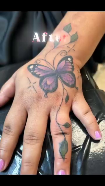 Butterfly and floral elements fine line tattoo on the hand by Lopez Dautruche