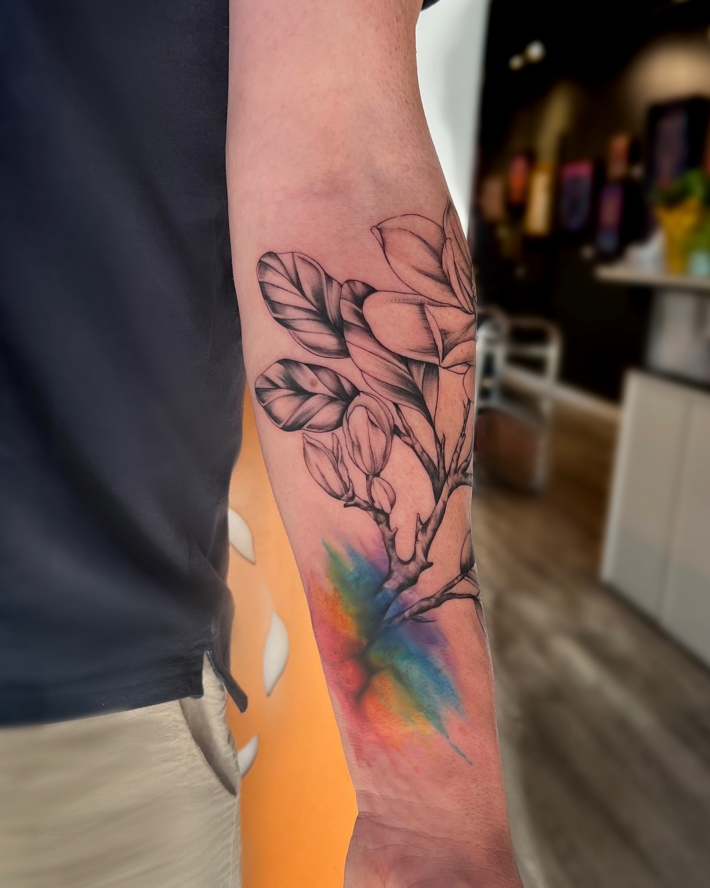 Magnolia blossom black and grey tattoo on the forearm by Amelia