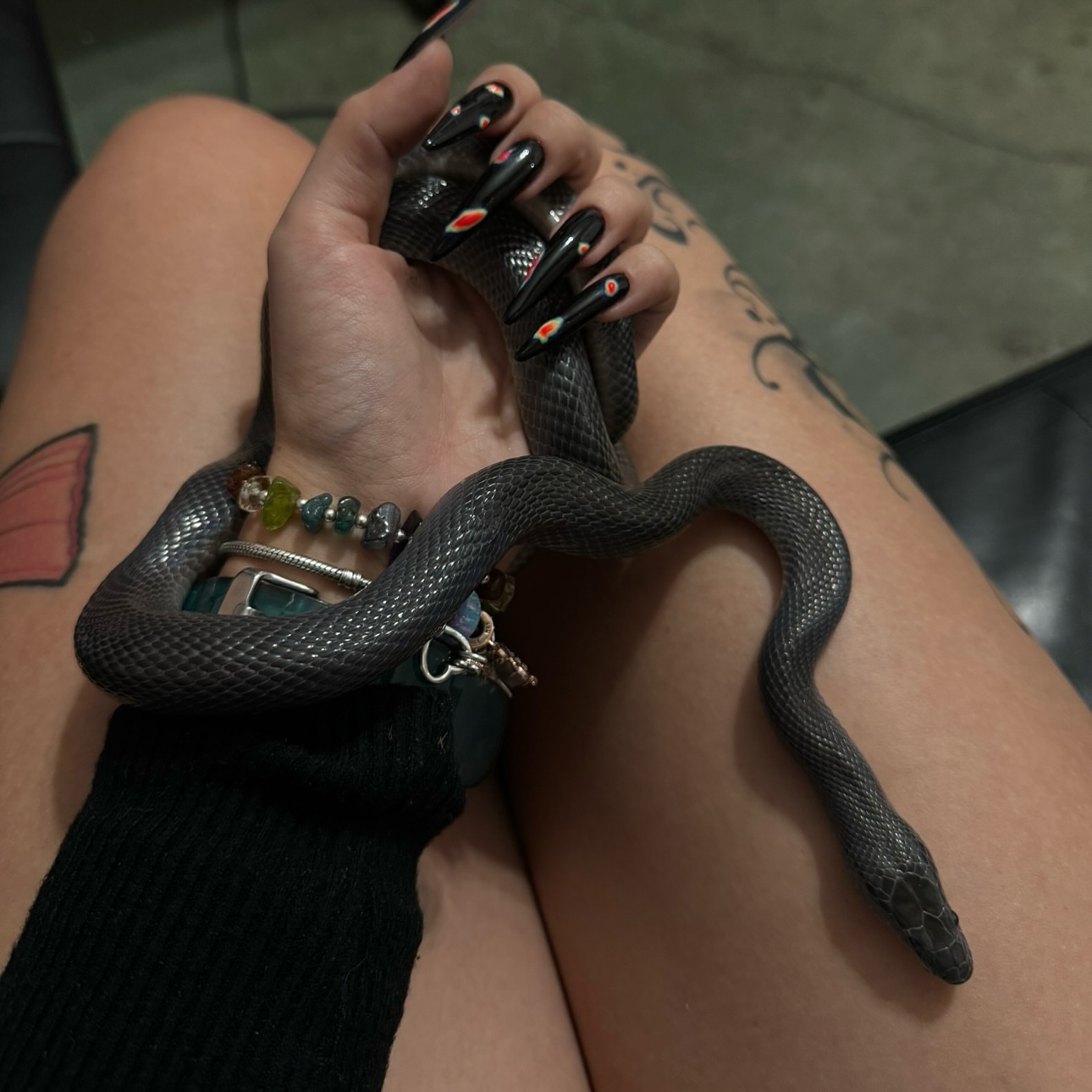 Snake black and grey tattoo on the leg by Dee, San Diego, California