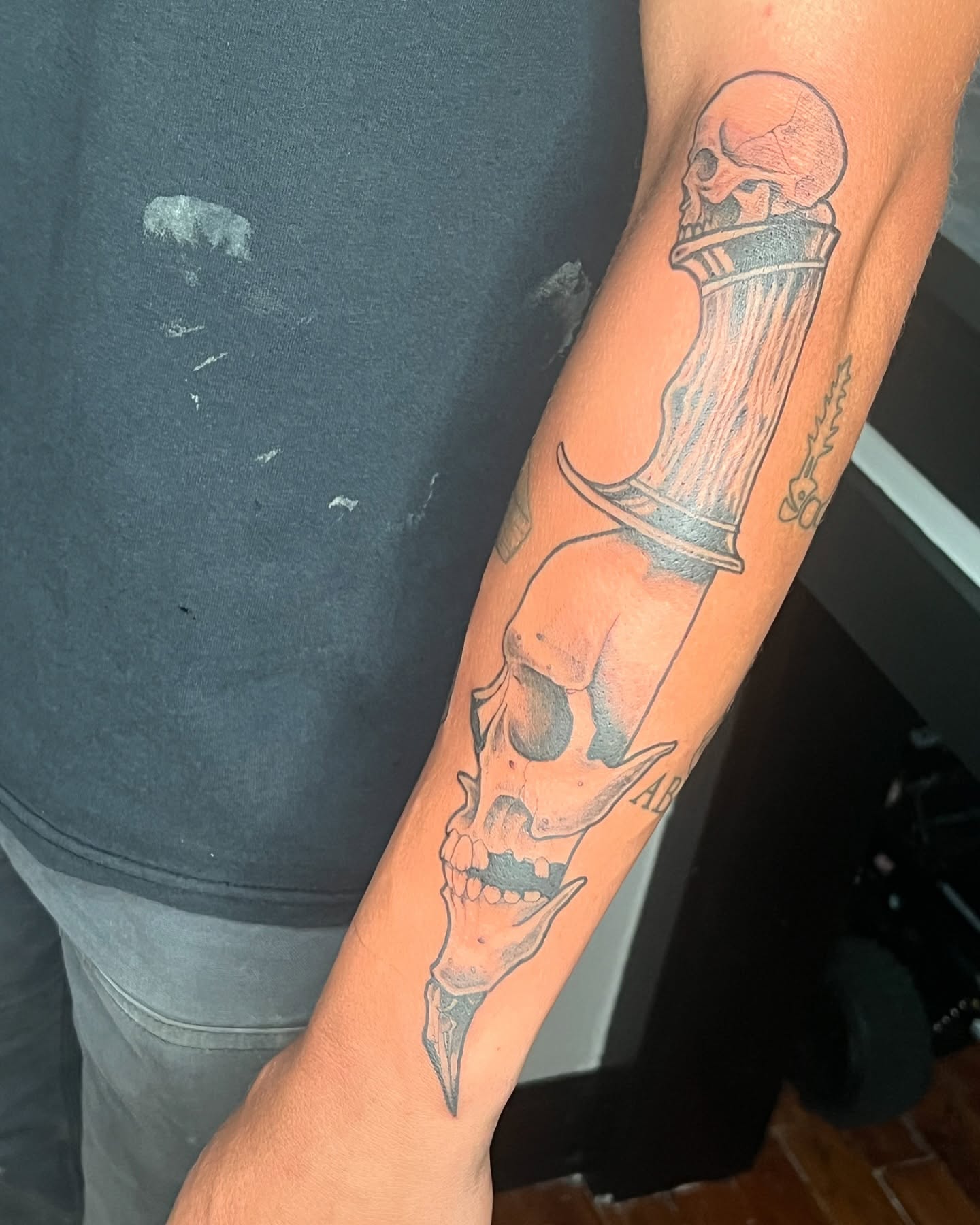 Skull and dagger black and grey tattoo on the forearm by Vincent C DiBiaso, Covington, Kentucky