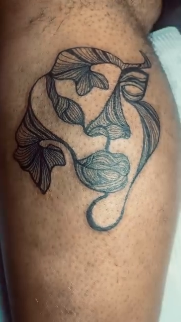 Abstract face with leaves fine line tattoo by Tiffany