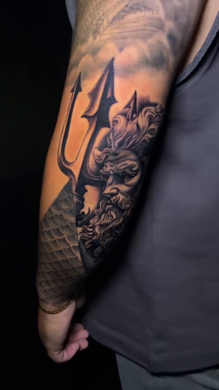 Poseidon with trident realism tattoo by Ian Vanderwerff