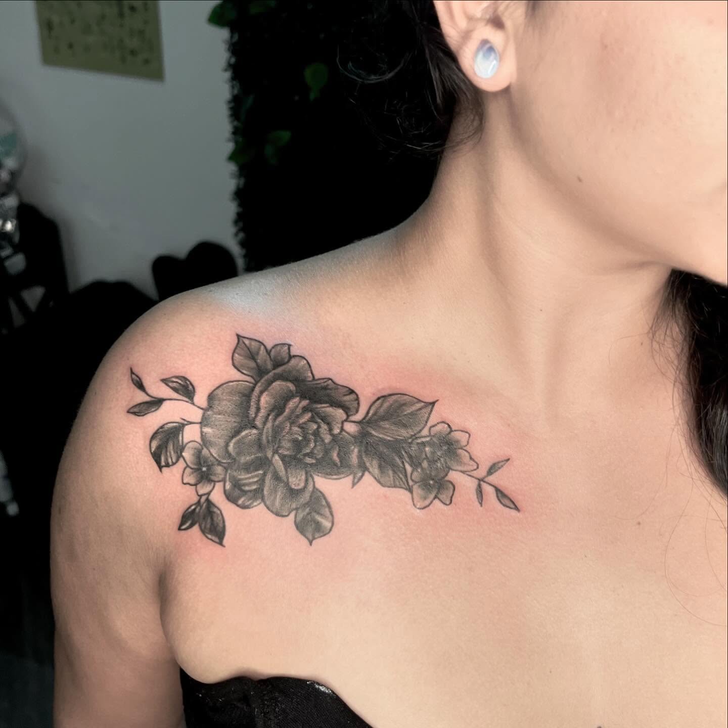 Flower bouquet black and grey tattoo on the shoulder by Syd Cheyenne