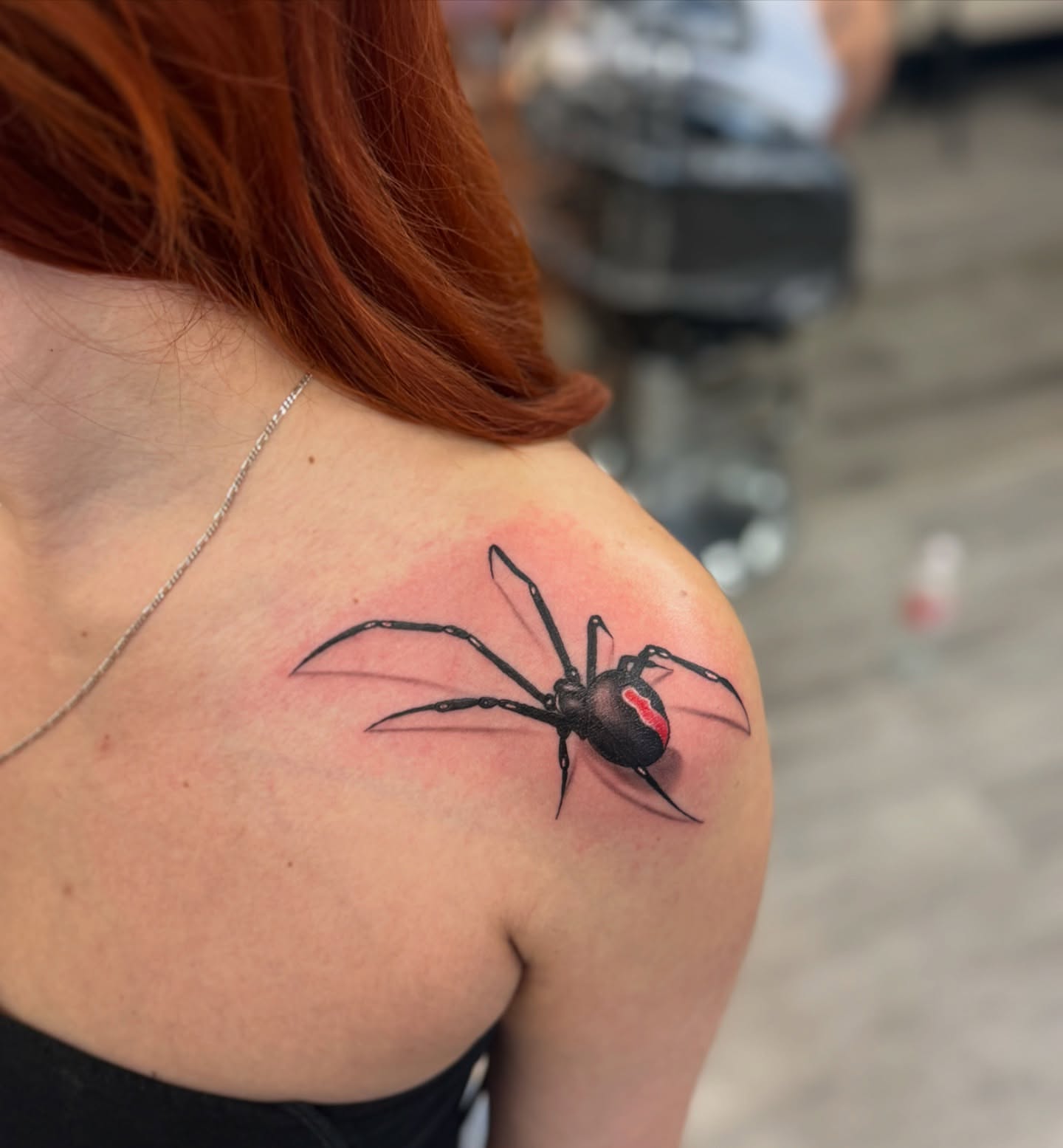 Black widow spider realism tattoo on the shoulder by Damian Sandoval