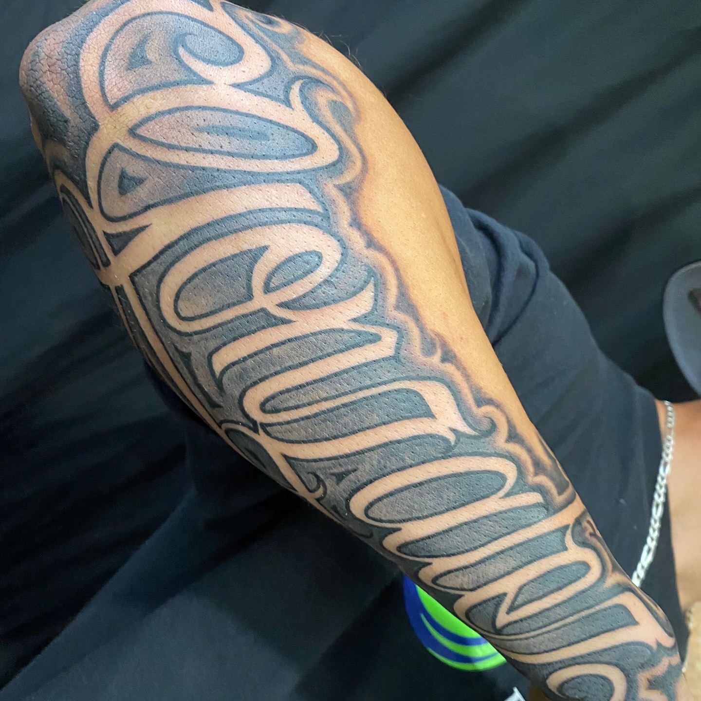 Script lettering lettering script tattoo on the forearm by El Pato, San Jose, California