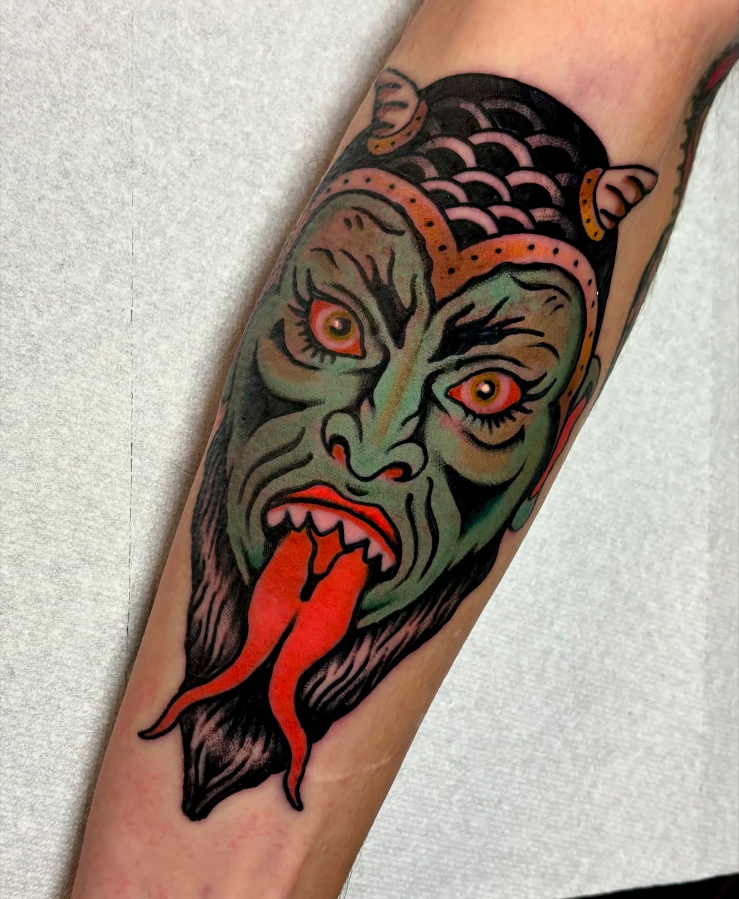 Ghoul face American traditional tattoo on the forearm by Weston Imhoff