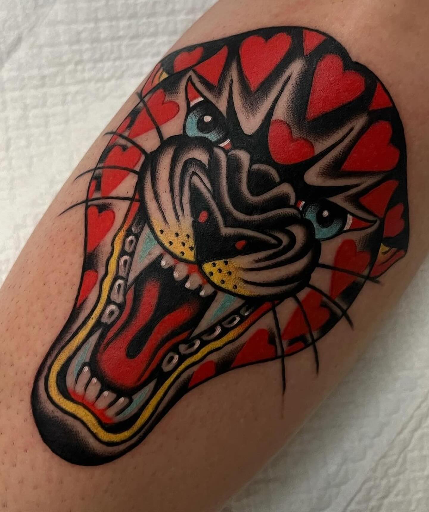 Snake American traditional tattoo on the forearm by Hailey Johnson