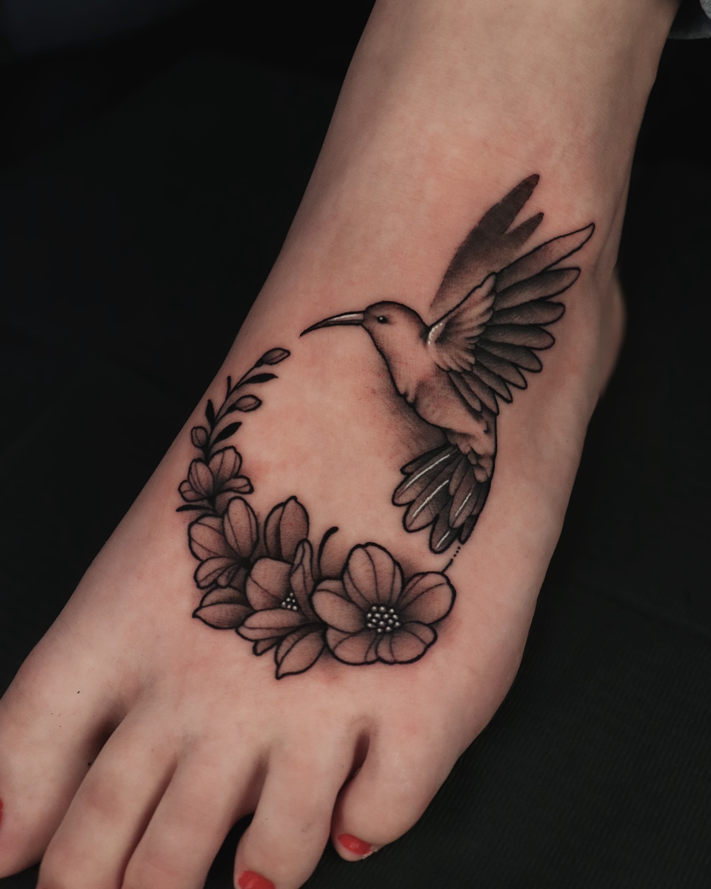 Hummingbird and flowers realism tattoo on the hand by Jeff Reindel