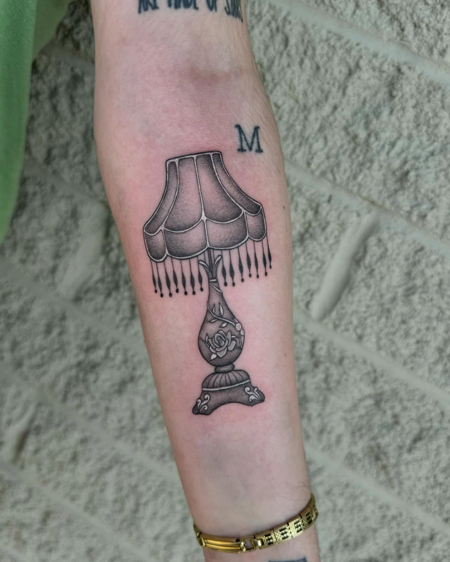 Lampshade black and grey tattoo on the forearm by Isabel Smith🦋🕷️