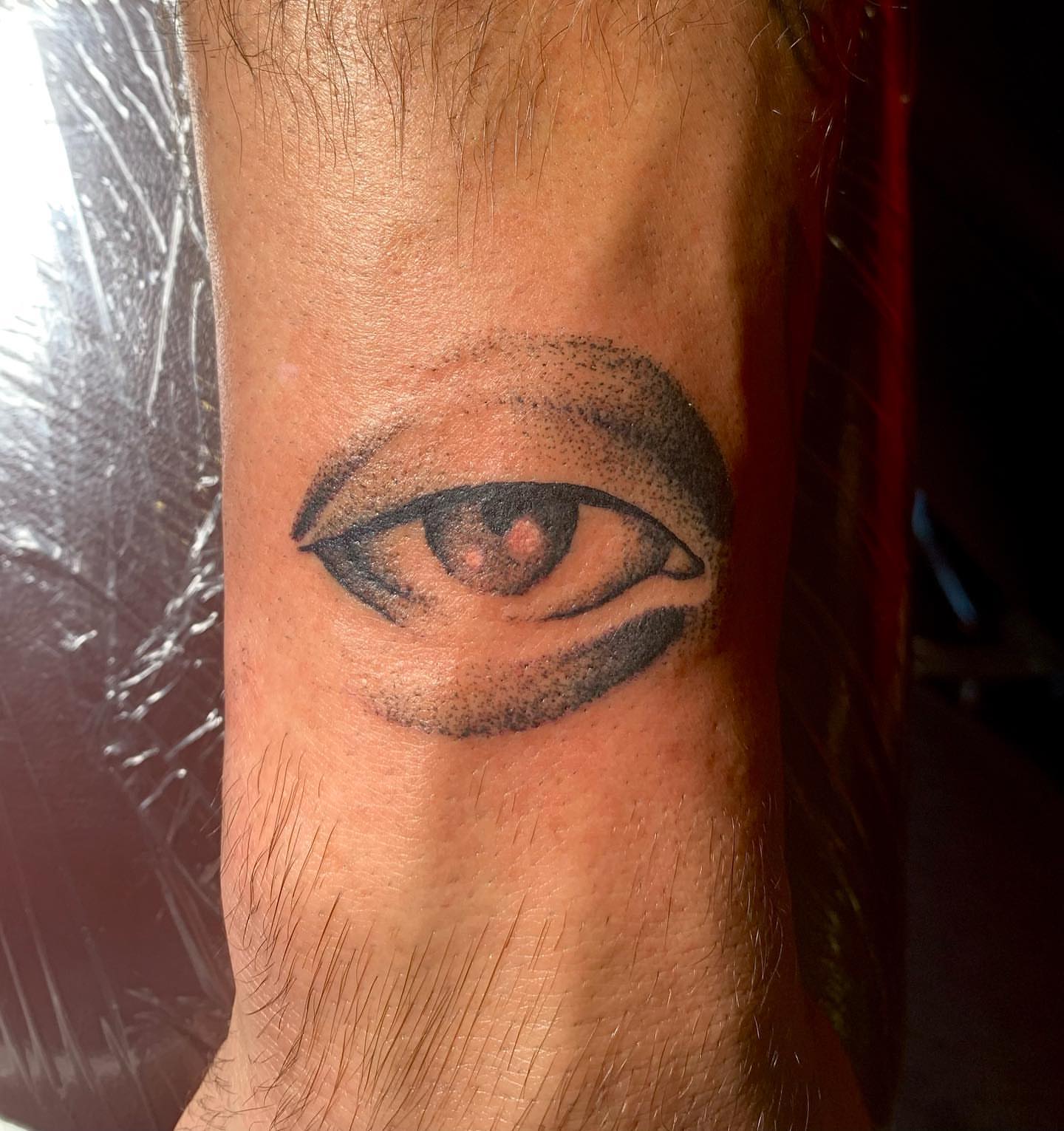 Eye dotwork tattoo on the forearm by Nolan Croteau