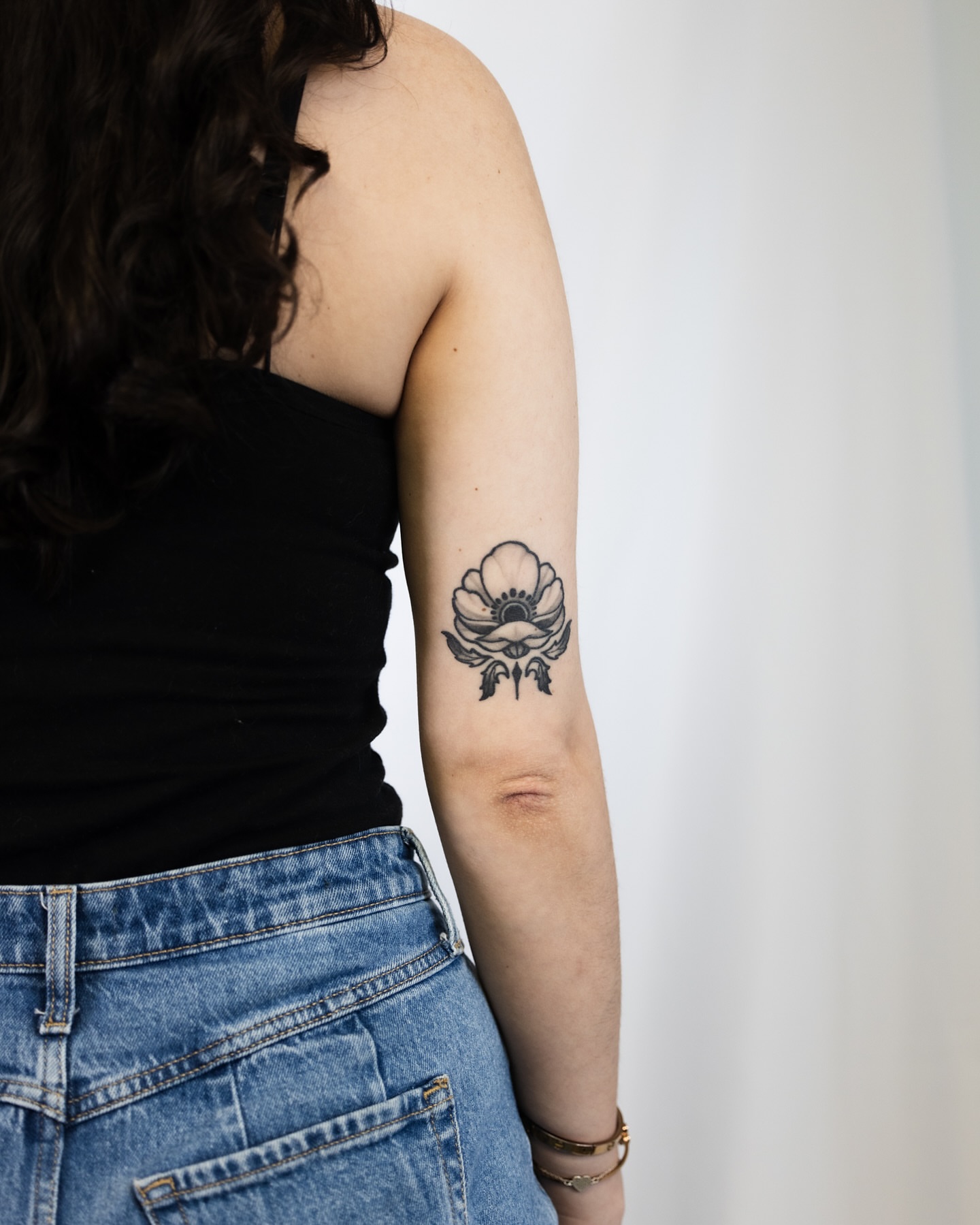 Flower black and grey tattoo on the forearm by Ben Cisek