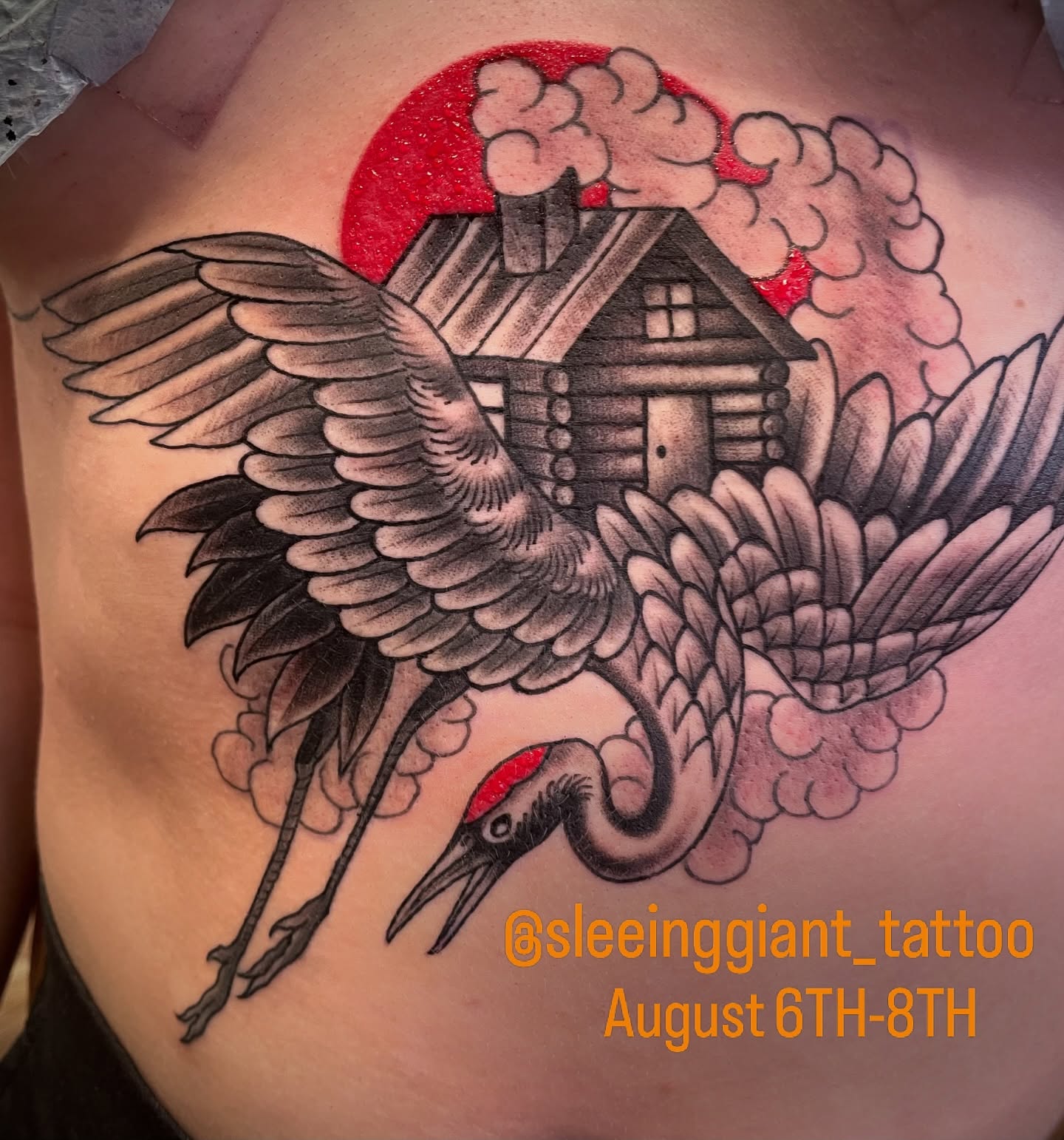 Crane and house American traditional tattoo on the chest by Brian Hutflies