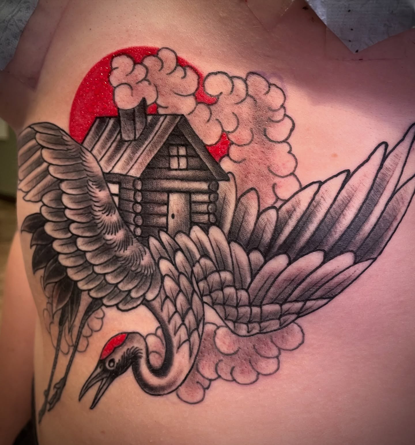 Bird and house American traditional tattoo on the chest by Brian Hutflies