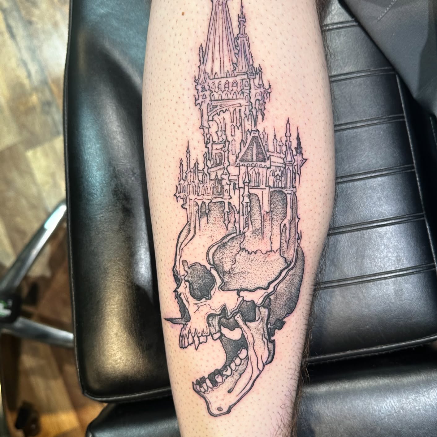 Castle and skull dotwork tattoo on the forearm by Benjamin Carlson