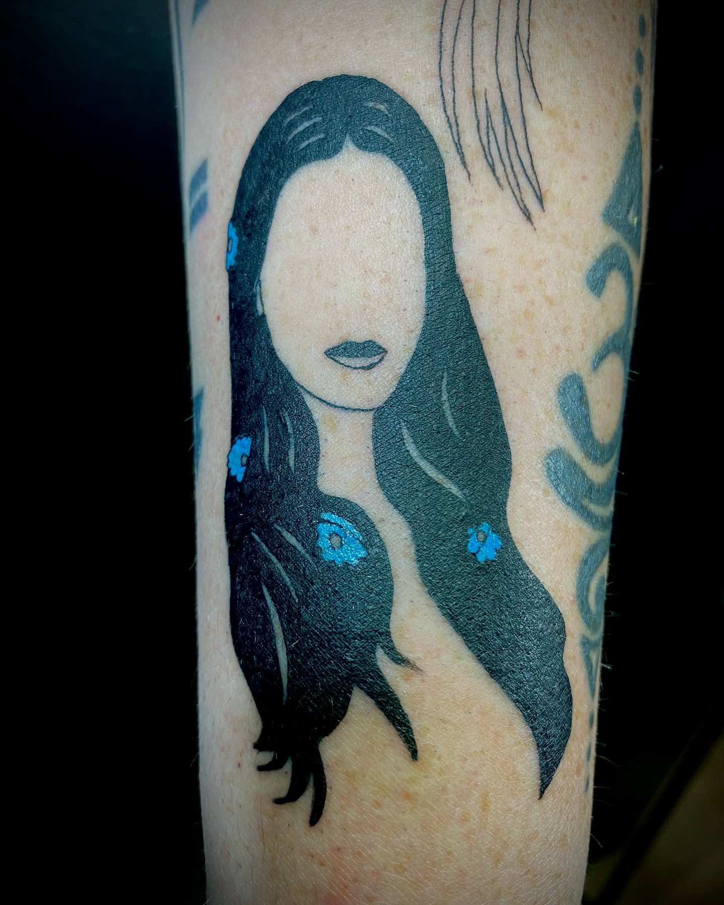 Woman with long hair black and grey tattoo on the forearm by 𝕷𝖚𝖈𝖎𝖉