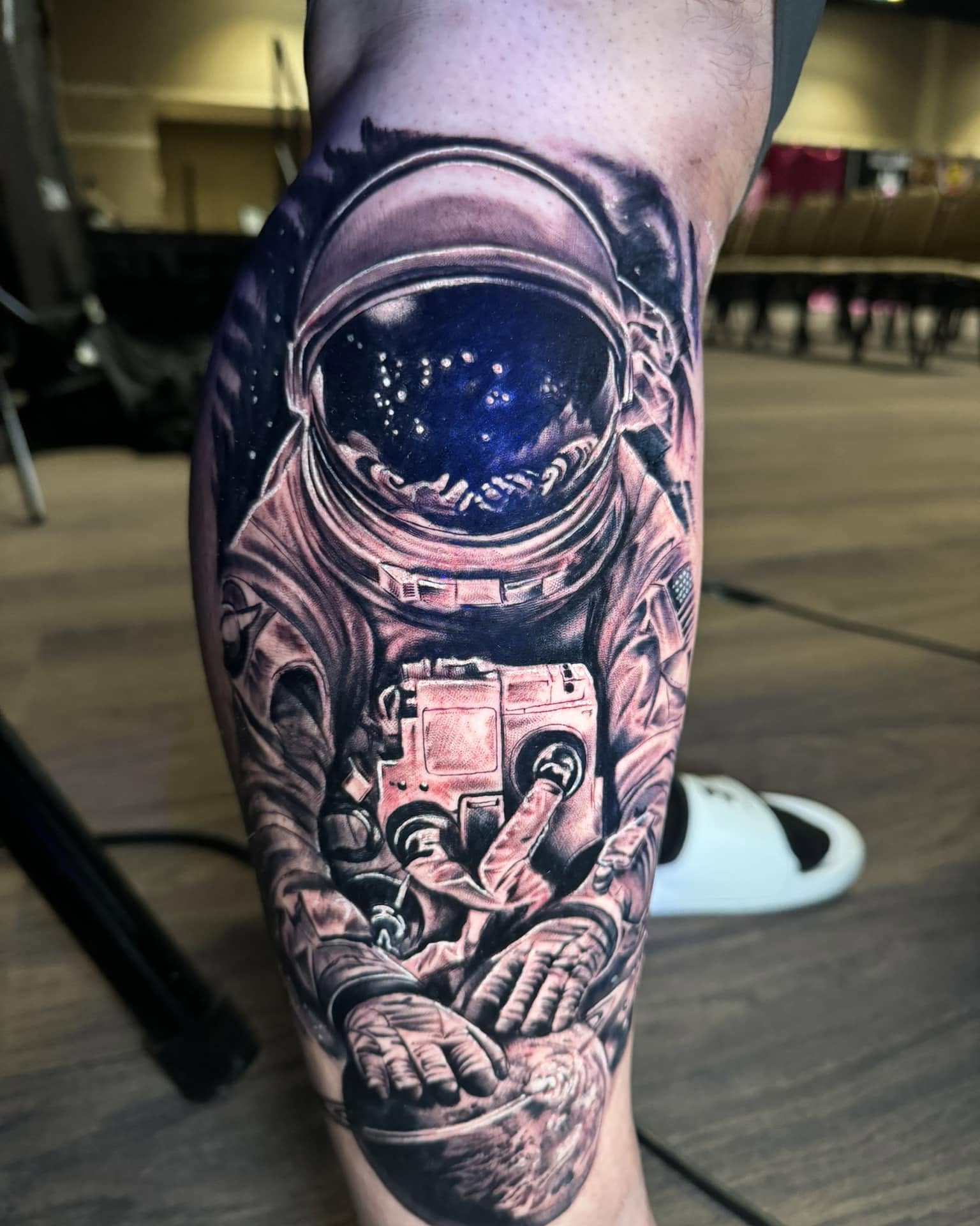 Astronaut realism tattoo on the forearm by Zacharee Osborn