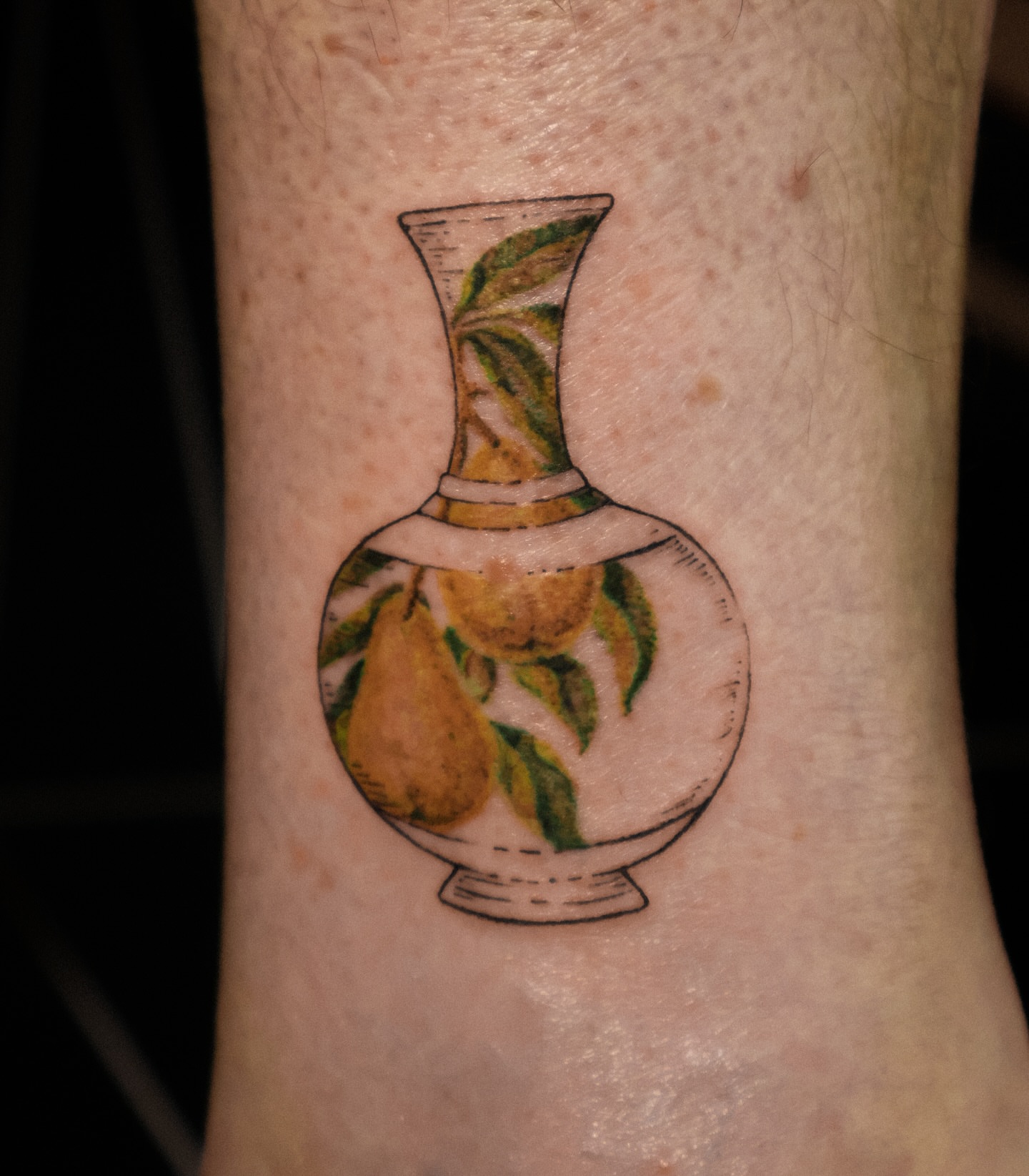 Vase with pears realism tattoo on the forearm by Grace Zarmina Hessam