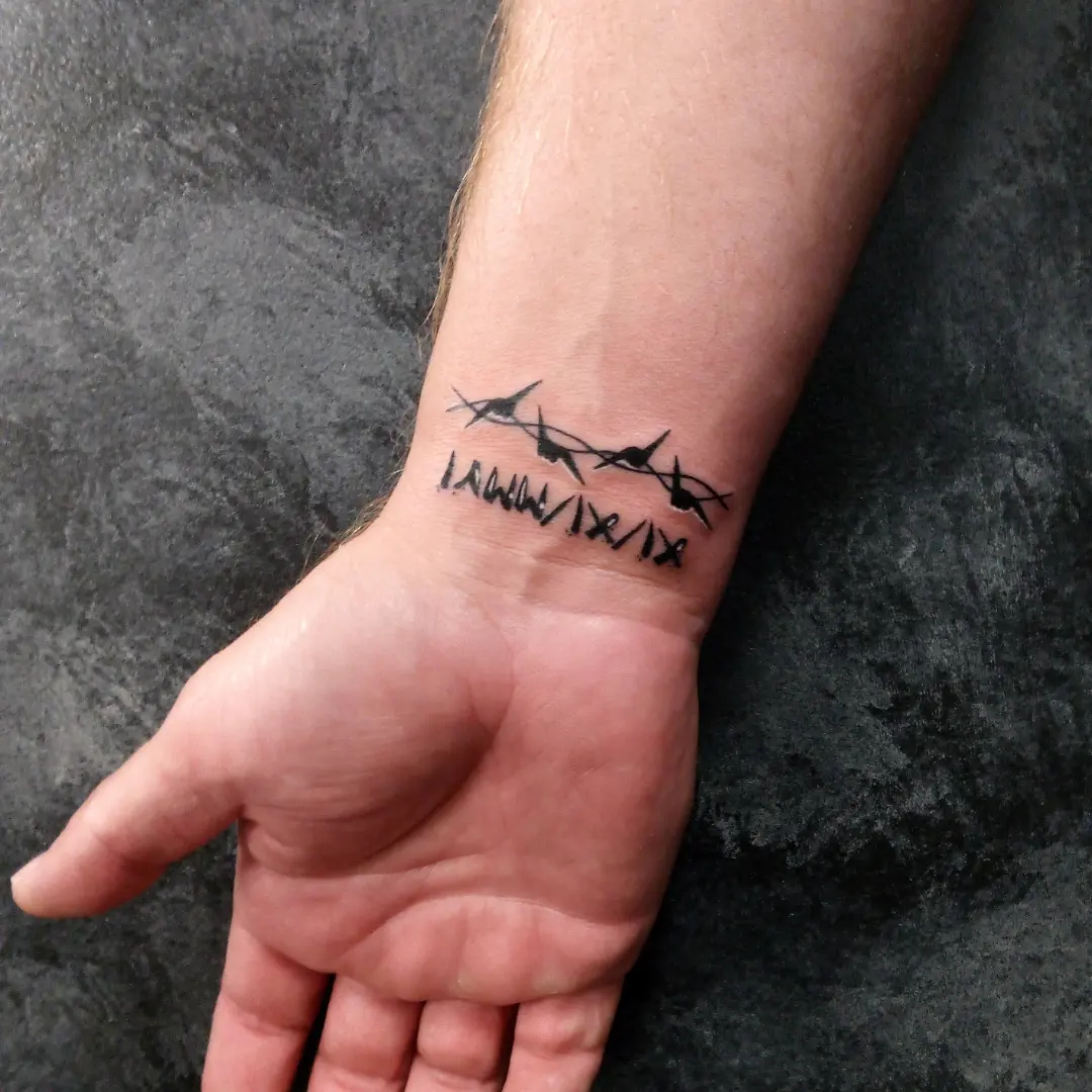 Barbed wire black and grey tattoo by Cassandra Davis