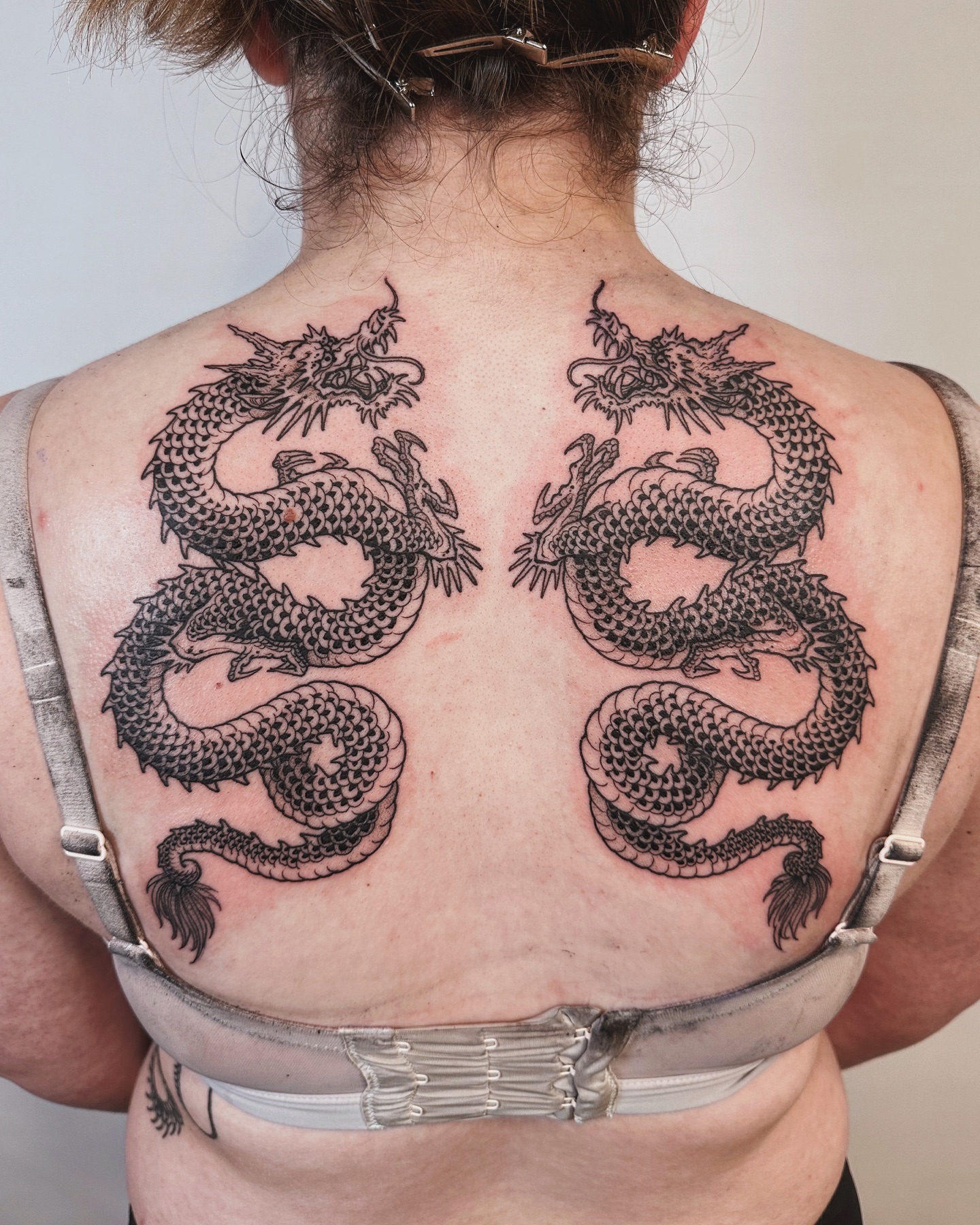 Dragon black and grey tattoo on the back by abigail 🌸